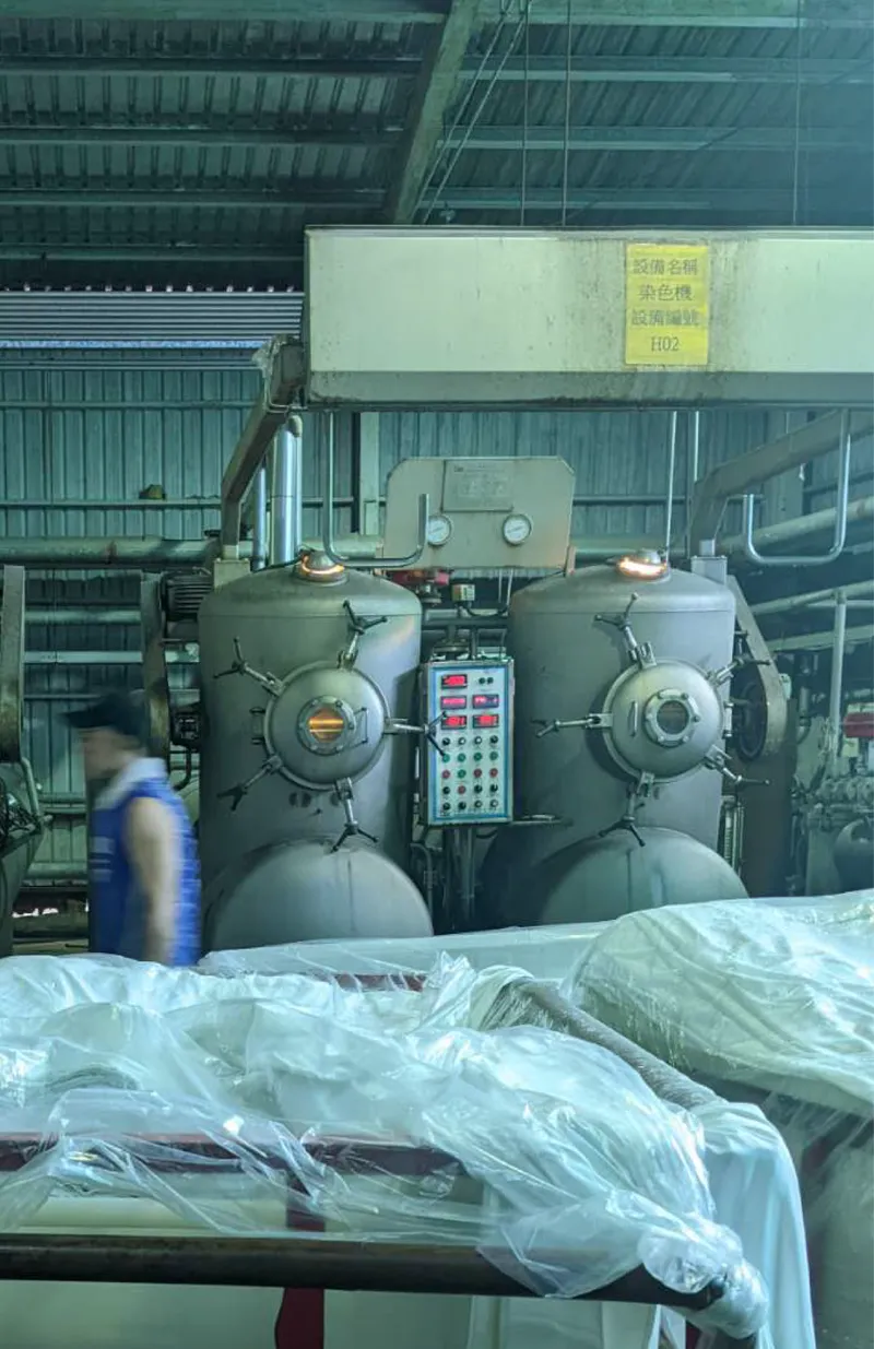 Textile dyeing machines on a factory floor